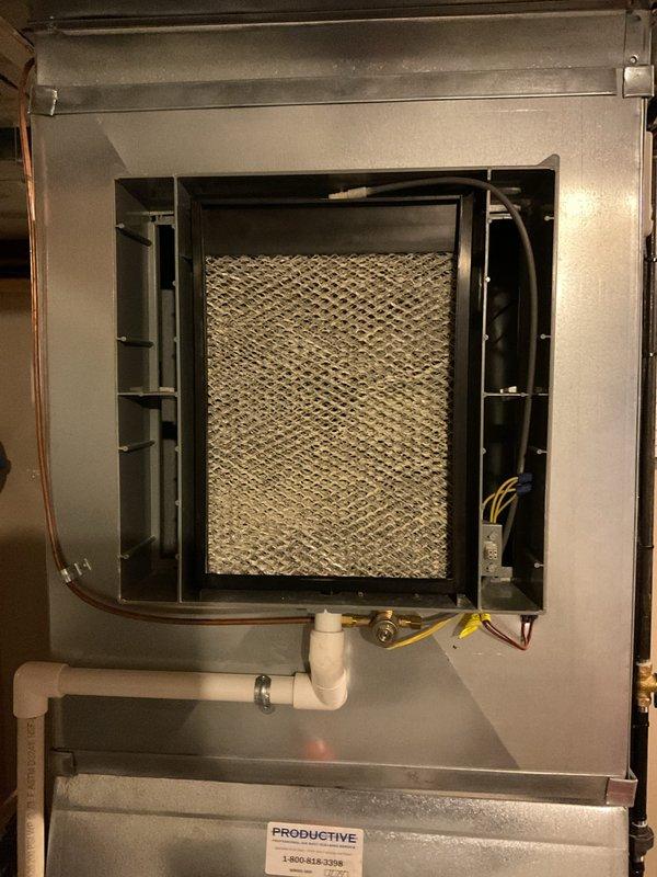 Performed scheduled maintenance on furnace and AC system. Inspected and documented condition of air filter in furnace, noting significant discoloration indicating replacement is needed. Examined condensate drainage system and electrical connections to ensure proper functioning of the heating system.