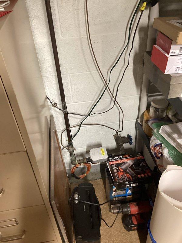 Performed complete replacement of outdated 45-year-old residential electrical panel. Removed existing panel showing signs of water damage and wear as evidenced by staining on surrounding wall. Installed new circuit breaker panel with proper conduit connections and organized wiring configuration to ensure code compliance and improved electrical safety for the home.