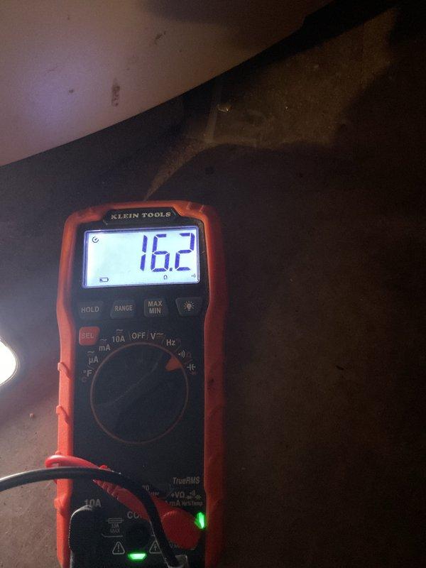 Performed minimum viable product heat visit which included inspection of pipe connections and fittings. Conducted electrical testing with multimeter showing 16.2V reading on system components. Documented visible corrosion on metal surfaces and verified condition of insulation materials and flexible conduits.