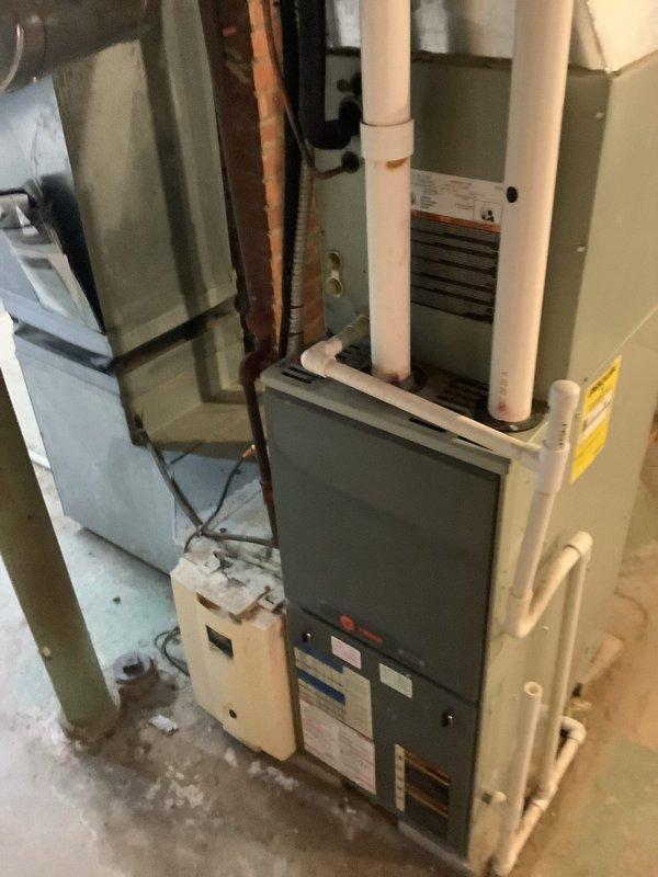 Successfully installed a complete 90% FRN furnace and AC system in the basement utility area, requiring access from Fairview street behind the property. The installation included proper connection of the furnace with metallic ductwork, PVC ventilation pipes, and integration with the existing plumbing system, resulting in a fully operational HVAC solution.
