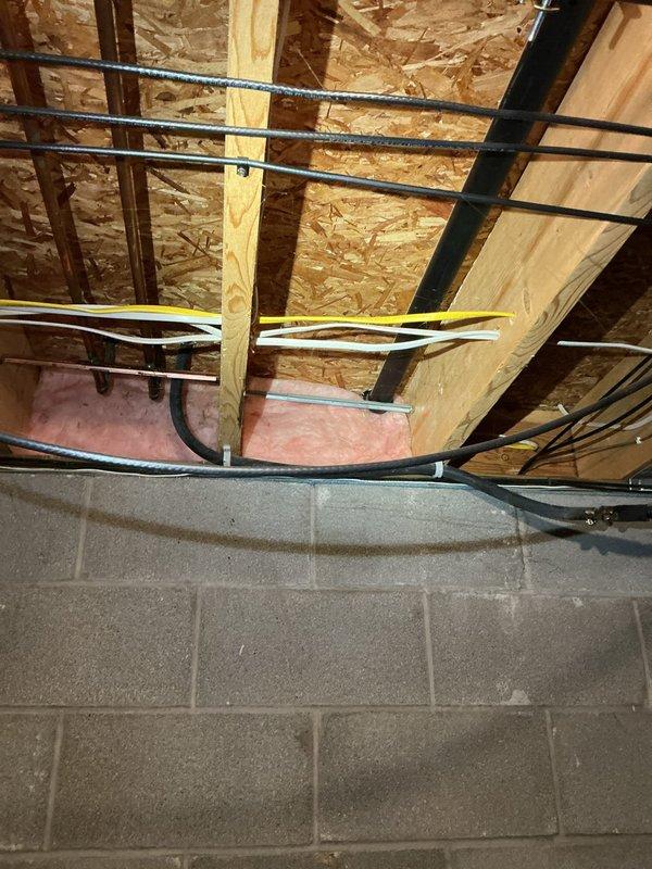 Responded to service call for kitchen sink clog. Inspected garbage disposal unit, which was properly connected to drain system with appropriate PVC drainage pipe and flexible waste line. Cleared obstruction and verified proper drainage function. Basement inspection revealed no issues with main drain lines or plumbing infrastructure.