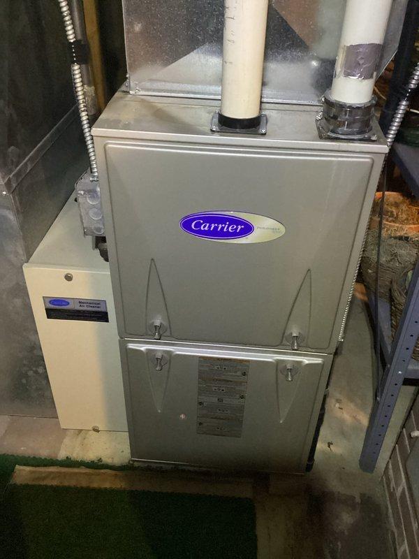 Performed scheduled maintenance tune-up on Carrier furnace system. Inspected interior components including blower wheel, gas valve assembly, and electrical connections for proper operation. All systems functioning normally with no issues detected; recommended continued annual maintenance to maintain optimal performance.