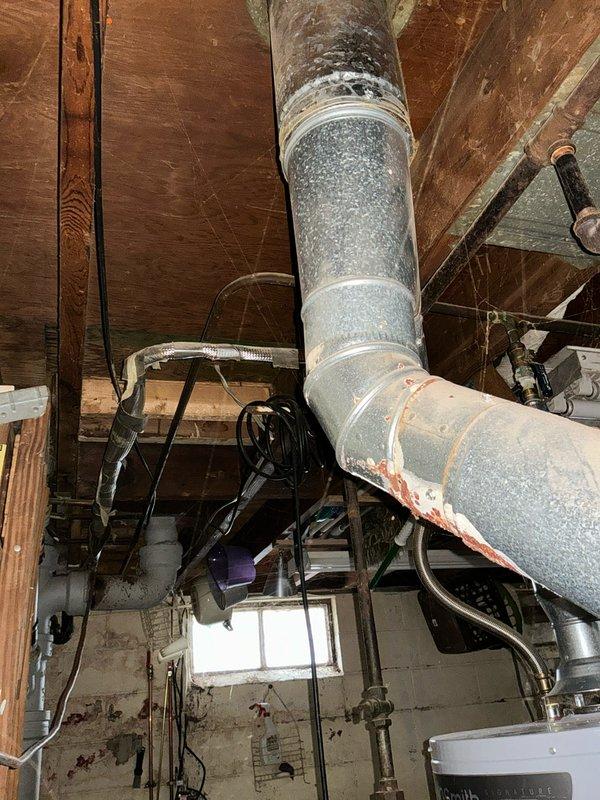 Assessed no-heat complaint on older Tempstar furnace in basement. Inspection revealed significant corrosion on ductwork joints and deteriorating connections. Replacement recommended due to age of system, visible deterioration, and previous service history.