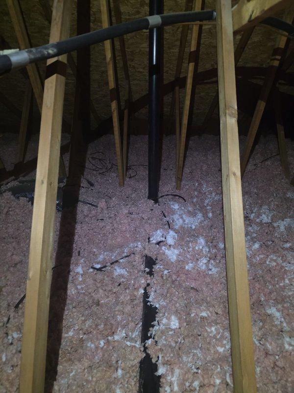 Performed second opinion inspection of attic where water leakage was reported. Discovered that during 2013 furnace replacement, the previous contractor failed to properly remove or cap the old furnace stack, causing water infiltration through the abandoned flue. Documented condition with photos showing water damage to insulation and surrounding structural elements.