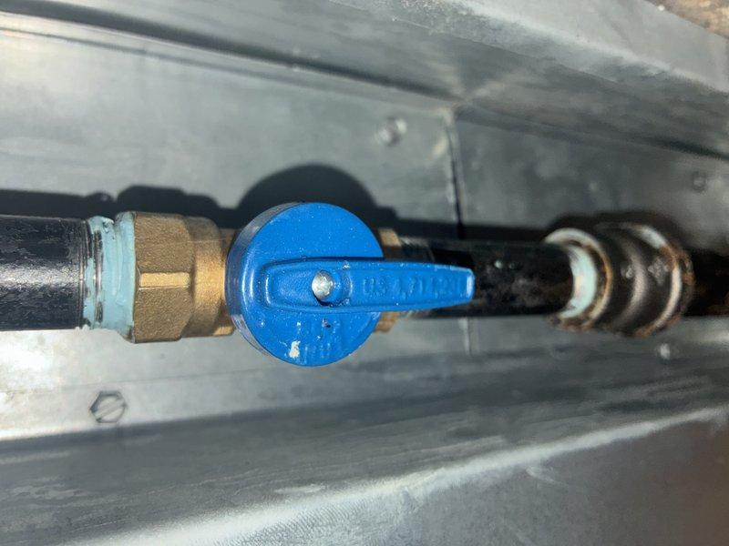 Performed annual maintenance service on 1-year-old heating system. Inspected blower wheel assembly for proper operation and cleaned components to ensure optimal airflow. Checked gas valve operation, confirming proper functionality of the blue Deluxe manual valve and associated brass fittings.