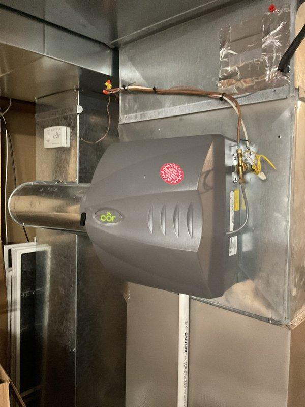 Performed standard maintenance on Carrier furnace system including inspection and cleaning of components. Verified proper operation of the CōR humidifier mounted to the ductwork, confirming water line connections and wiring were secure and functioning correctly. System is in good working condition with no issues identified.