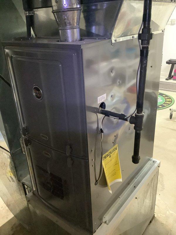 Performed routine MVP Heating maintenance service on residential furnace of indeterminate age. Inspection revealed significant corrosion on the evaporator coil's copper mesh screen, indicating potential airflow restriction and reduced system efficiency. Documented system condition with photos for future reference and service planning.