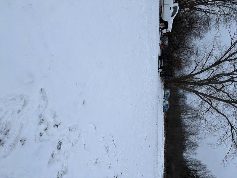 Performed site assessment for gas and water line installation to modular home. Documented winter site conditions, including snow-covered terrain, water feature and existing pathway that will impact installation planning. Photos taken to support comprehensive quote development.