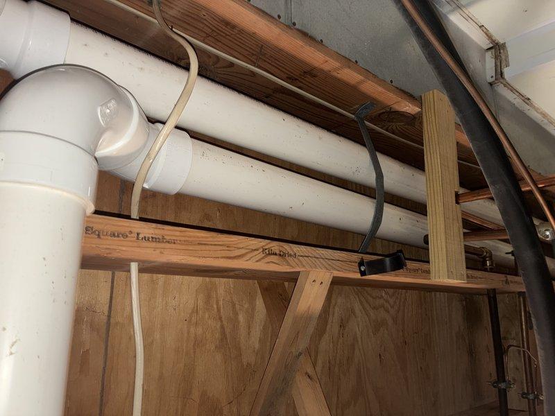 Performed routine furnace tune-up as scheduled. Inspected condensate drain system including PVC piping and P-trap for proper installation and function. Examined water shut-off valve and surrounding plumbing connections for signs of corrosion or leaks; all components appear to be functioning correctly with only minor oxidation noted at connection points.