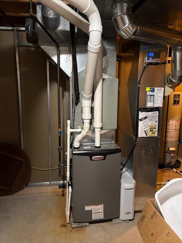 Successfully installed a new Lennox 90% efficiency furnace in the basement utility area, including proper connection of PVC ventilation pipes, flexible gas line with shut-off valve, and integration with existing ductwork. All systems were tested for proper operation, and documentation photos were taken of the completed installation showing the main unit and associated mechanical components.