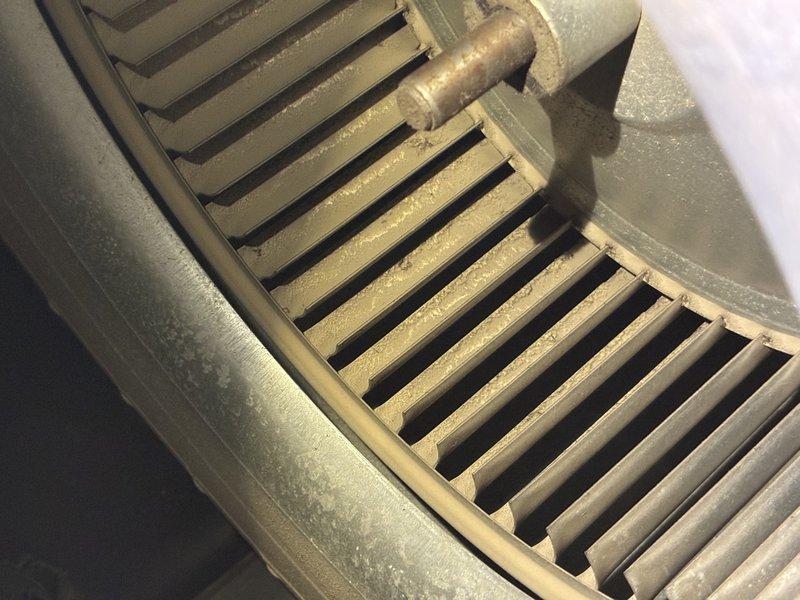 Performed MVP tune up on heating system. Inspected blower wheel which showed significant dust accumulation between fins, indicating maintenance was needed. Used hex key tool to access and service components as part of standard preventive maintenance protocol.