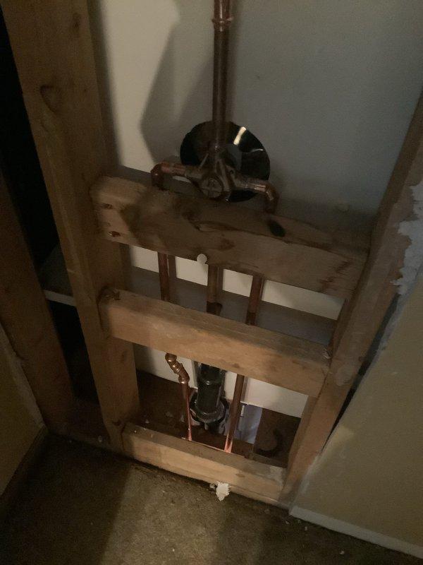 Replaced corroded water supply valves in basement ceiling and rebuilt plumbing lines extending to the shower valve. Installed new Moen Chatteau chrome tub/shower faucet to resolve water control issues. Customer advised that drywall repairs would be their responsibility.