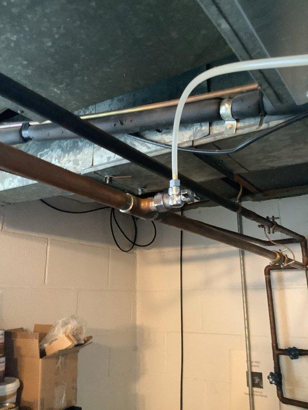 Successfully completed replacement of leaking 40-gallon tall gas water heater with new unit featuring 6-year manufacturer warranty. Work included rebuilding hot and cold water lines, replacing gas and cold water inlet valves, installing thermal expansion tank, bonding water lines, and extending the relief drop. All components were properly installed according to code requirements in the utility area.