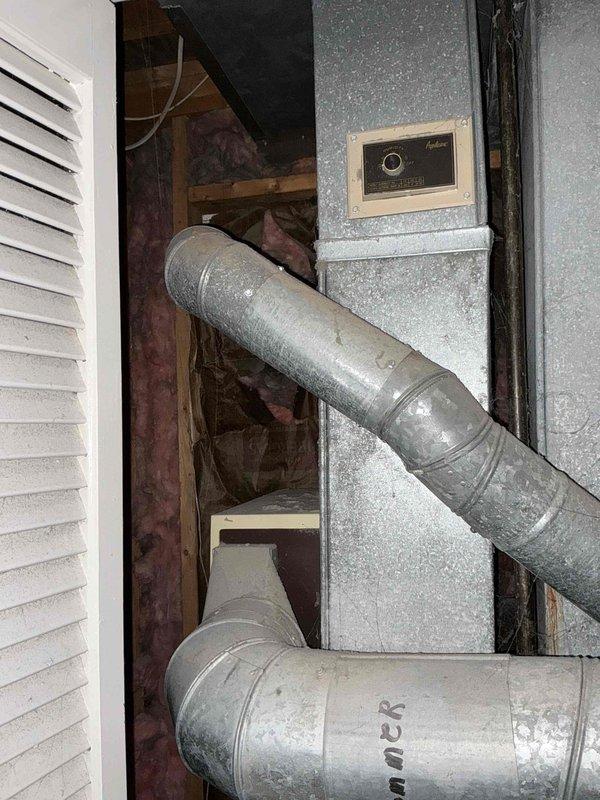 Performed comprehensive evaluation of 40-year-old HVAC system showing significant wear, including visible rust stains and water damage on cabinet exterior. Inspection revealed aged internal components with dust accumulation throughout, particularly on control board connections and ductwork junctions, indicating end-of-life condition and recommending full system replacement.