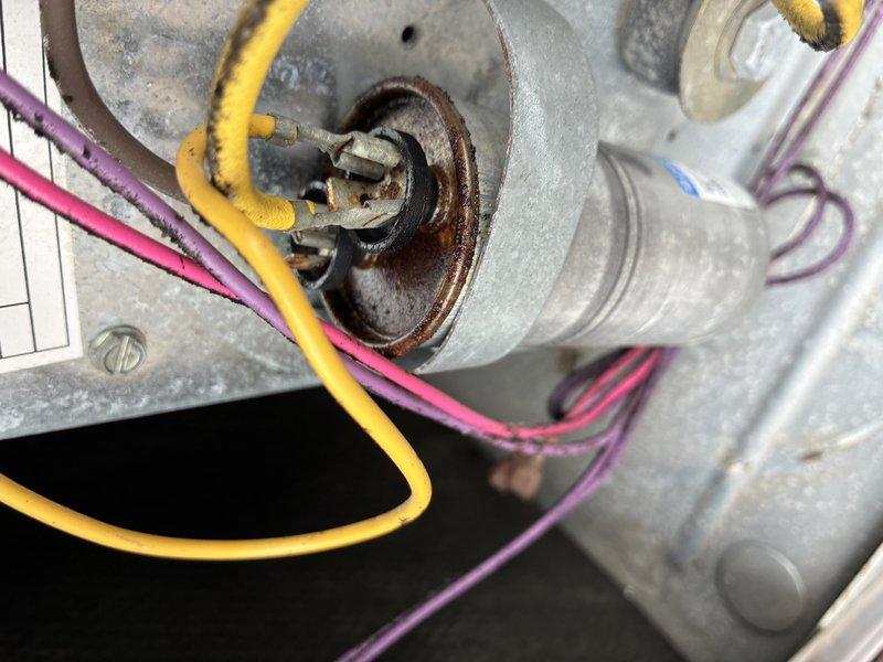 Performed routine maintenance on rooftop HVAC unit. Identified significant corrosion on motor shaft/bearing assembly and substantial dust accumulation on evaporator coils impeding airflow. Cleaned coils and documented failing components for future replacement recommendation.