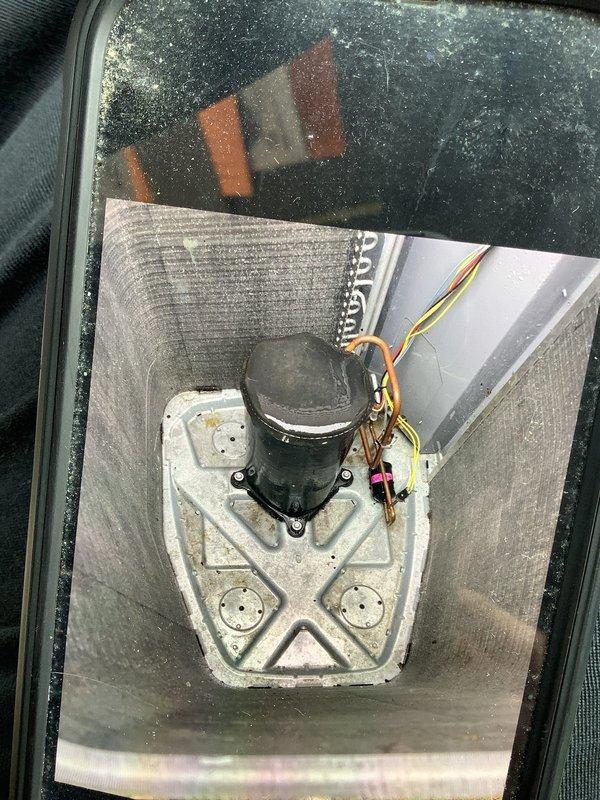 Performed comprehensive AC tune-up on residential system of undetermined age. Inspected and cleaned outdoor condenser unit, removing accumulated debris from around base and fins. Examined motor/compressor assembly, noting normal operational wear and verified proper electrical connections to ensure optimal system performance.