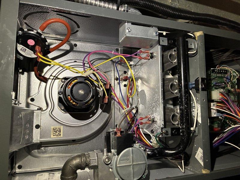 Performed prepaid furnace preventive maintenance on MVP 1230 unit. Inspected blower wheel assembly and motor mounting, noting proper condition of the bushing and shaft components. Examined electrical connections and wiring harnesses throughout the system, with all components functioning as expected.