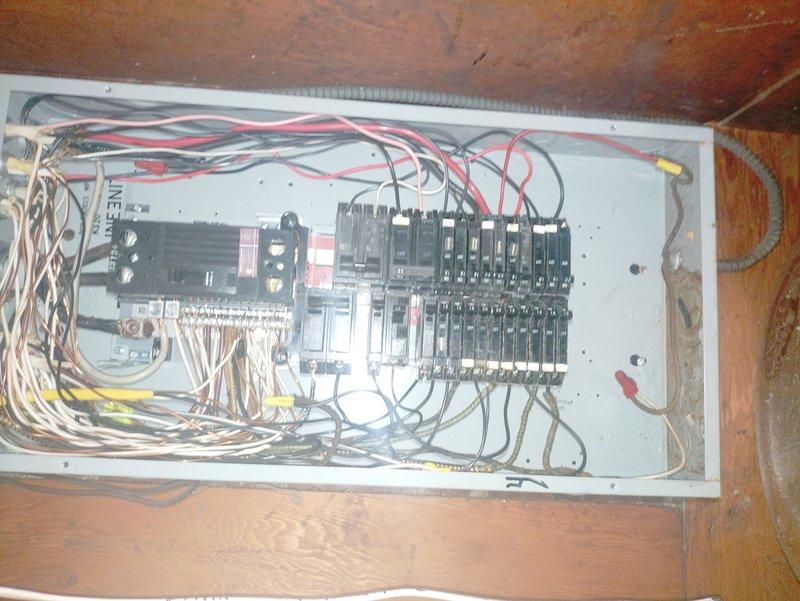 Responded to service call regarding kitchen wall outlets not functioning properly. Inspected electrical panel to identify potential issues with circuit breakers and wiring connections. Observed older wiring configuration with some disorganization that required remediation to restore proper power to kitchen outlets.