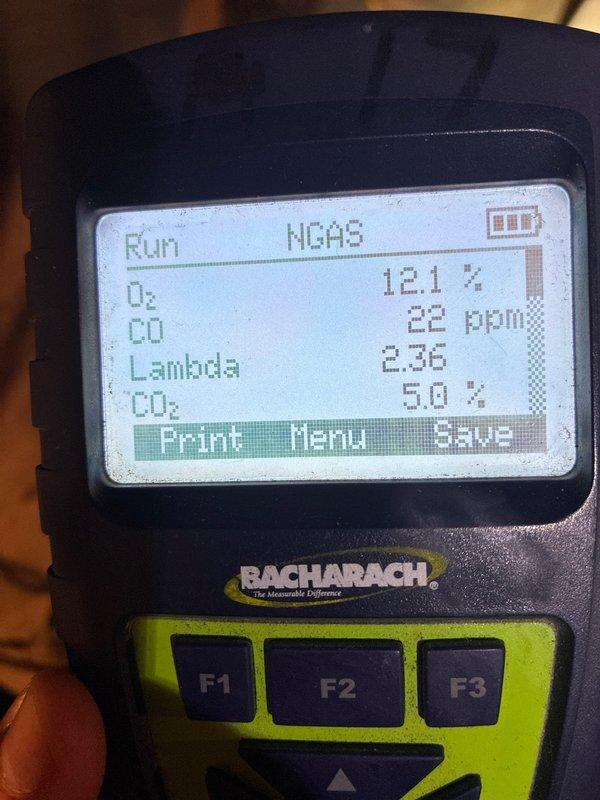 Performed annual heating tune-up on 10+ year old gas furnace. Removed access panel to inspect blower motor assembly, gas valve components and heat exchanger. Combustion analysis with Bacharach analyzer showed acceptable readings (O₂: 12.1%, CO: 22ppm, CO₂: 5.0%, Lambda: 2.36), indicating proper operation within normal parameters.