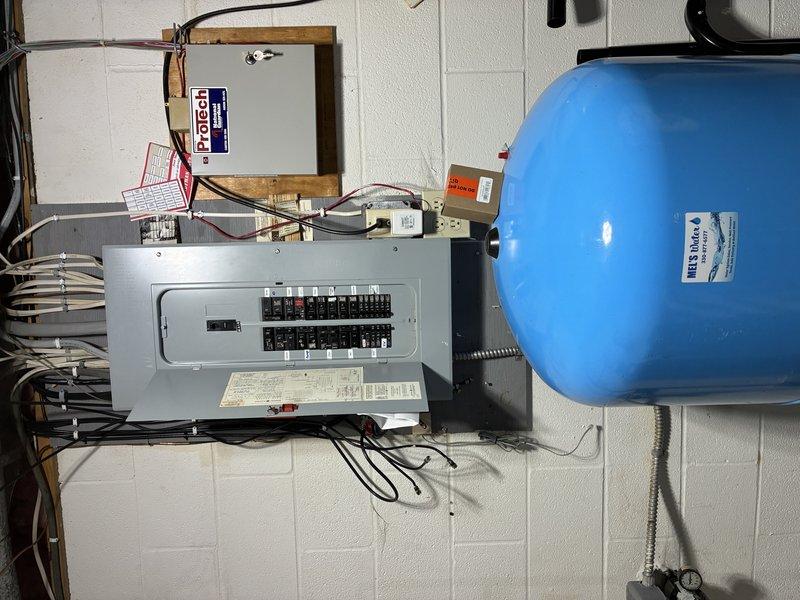 Conducted site assessment for generator installation, evaluating electrical panel and exterior wall for optimal placement of transfer switch and connection points. Proposed running dedicated line from main breaker panel to exterior wall for portable generator hookup, including necessary conduit, weatherproof connections, and code-compliant transfer mechanism.