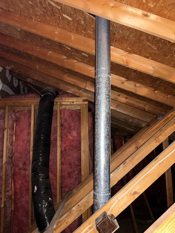 Conducted site assessment for furnace replacement at residential property with 32-year-old existing system. Exterior inspection revealed two aging condenser units with weathered components and electrical connections requiring evaluation. Interior examination of attic space showed metal ductwork with visible seams and insulated flexible ducting that will need to be considered in the replacement plan.