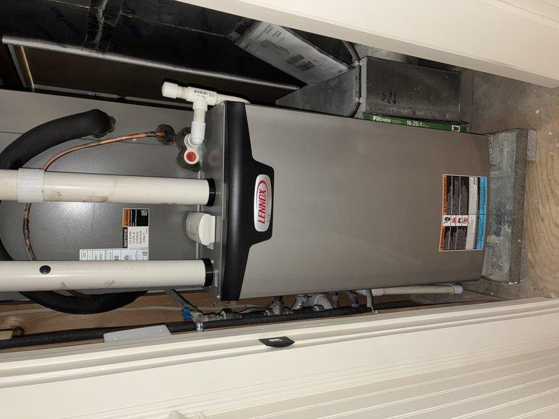 Completed scheduled IAQ service on Lennox HVAC system and inspected wall-mounted Reznor heating unit. Applied humidifier drain tabs (#413) for preventive maintenance and documented system condition with photos for service records.