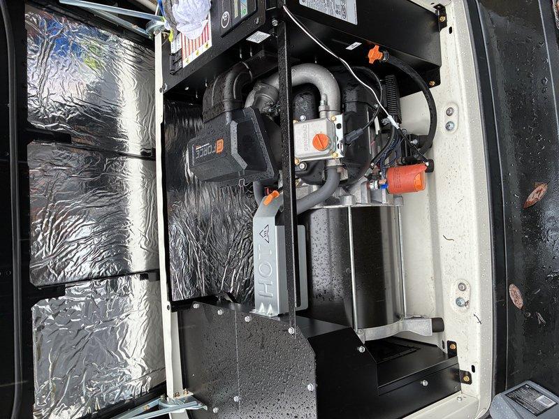 Performed scheduled maintenance on 1-year-old residential generator system. Conducted comprehensive inspection of exterior housing and ventilation panels, confirming proper installation on mulch bed with adequate clearance. Examined interior components including pump assembly, connection points, and insulation material; verified all mechanical connections were secure and operational status indicators functioning normally.