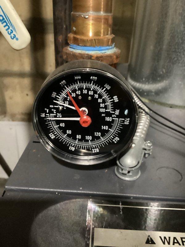 Performed scheduled maintenance on mini split system and boiler. Checked system pressures which were reading approximately 30-35 PSI, within normal operating range. Inspected water supply components including pressure regulator valve and associated copper/galvanized piping, confirming proper operation of both heating systems.