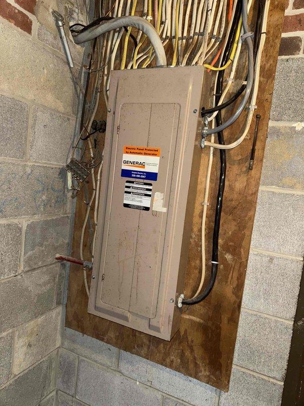 Performed scheduled MVP maintenance service on 21-year-old boiler system. Inspected electrical transfer switch connections and noted significant corrosion on copper water valve with orange handle. Documented aging plumbing infrastructure with oxidation present at connection points for future reference.