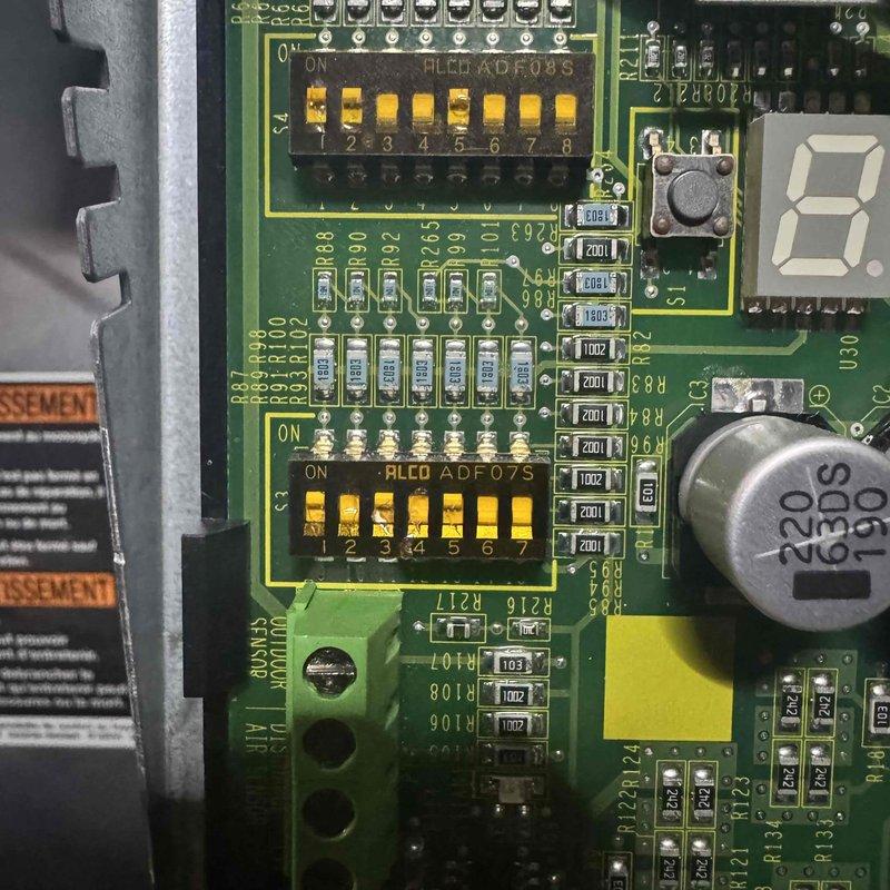 Performed scheduled BS-MVP Heating Visit on 2-year-old unit. Inspected PCB components including DIP switch banks (HLCD ADF.08S) and verified proper switch positioning. Examined blower motor assembly, checked wiring connections, and confirmed proper operation of the ventilation system with no visible issues detected.