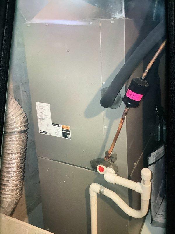 Performed scheduled BS-MVP heating maintenance visit on residential furnace system. Inspected air handler unit, verified proper installation of drain lines and condensate removal system, and confirmed refrigerant lines were properly connected with filter drier intact. System was found to be operating within normal parameters with no issues detected.