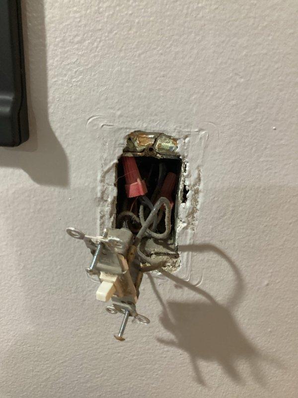 Inspected customer's sitting room to provide quote for installation of customer-supplied lighting fixtures and ceiling fans. Observed damaged electrical boxes with exposed wiring in walls requiring proper installation and repair. Accessed attic space to evaluate wiring pathways for new fixture installations where currently none exist.