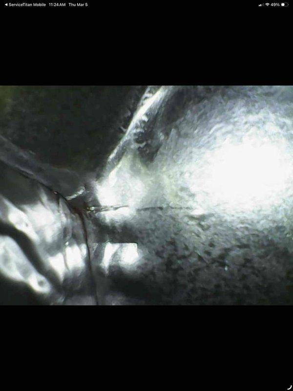 Performed routine maintenance on furnace as part of MVP service agreement. Identified significant frost buildup on refrigerant lines, indicating potential restriction or airflow issues. Inspected control board and wiring connections, noting all components were properly secured with no visible damage or loose terminations.