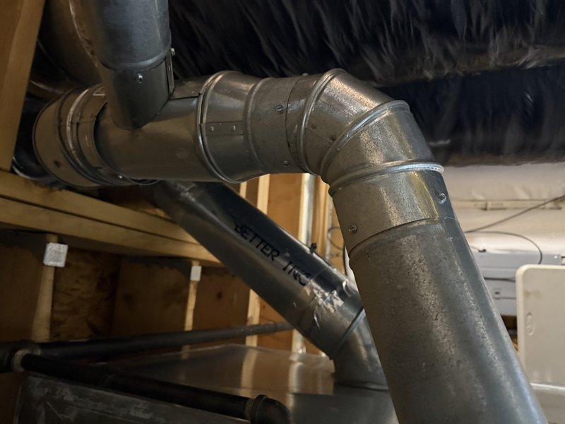 Completed comprehensive assessment for heating and cooling system replacement in medium-sized residential property (1500-3000 sq.ft.) with basement installation. Evaluated existing ductwork condition, noting proper metal elbow joints and connections, and inspected current furnace/air handler unit with associated black insulated ducts. Recommended Lennox A/C and gas furnace vertical upflow/downflow system as optimal replacement solution for the property's requirements.