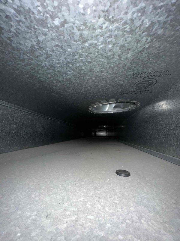Completed comprehensive duct cleaning service on residential HVAC system, thoroughly removing accumulated debris and contaminants from supply and return ductwork. Inspection photos confirm successful cleaning of the galvanized sheet metal ducts, including proper treatment of the textured insulated surfaces and clearing of all vents including ceiling register with fan assembly. System now operating at optimal efficiency with improved indoor air quality.