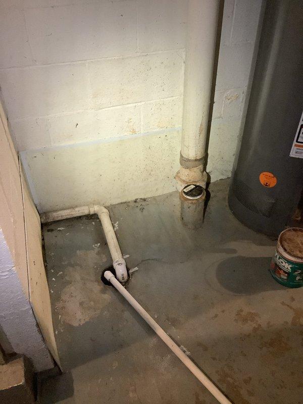 Responded to service call for main drain backing up during washer discharge. Upon inspection, discovered blockage in basement drain line. Successfully cleared obstruction using drain snake/auger, removing accumulated debris and restoring proper drainage. Verified system functionality with test run.