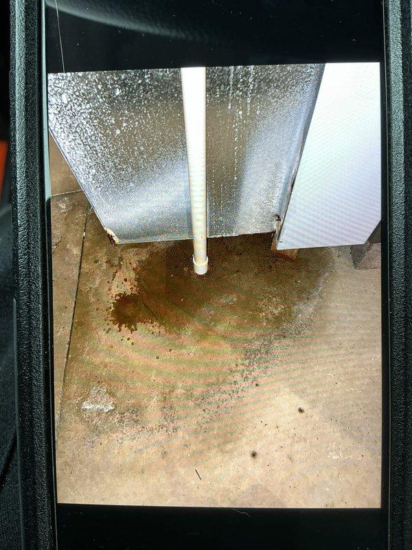 Completed scheduled heating maintenance service on 5-year-old system. Replaced air filters and inspected system components. Identified significant moisture issue with water pooling on concrete floor beneath unit and condensation on ceiling panels, suggesting possible drainage problem requiring further attention.