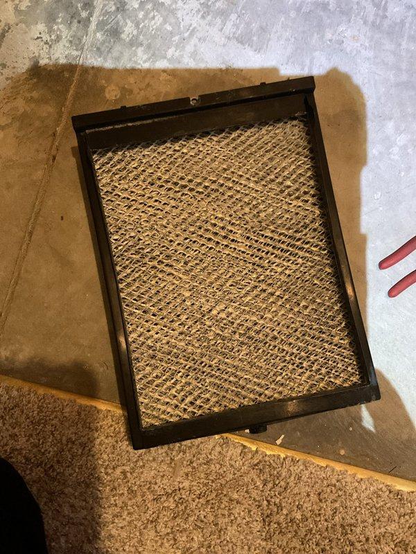 Installed new programmable thermostat as part of warranty service. Replaced dirty air filter during installation and verified system functionality with proper temperature display and control operation.