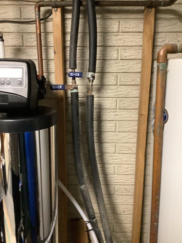 Performed diagnostic service on conventional tank-type water heater that repeatedly tripped circuit breaker. Reset breaker initially which restored operation temporarily, but unit failed again within 24 hours, indicating potential electrical component failure. Inspected installation components and documented existing plumbing configuration with photos for further analysis.