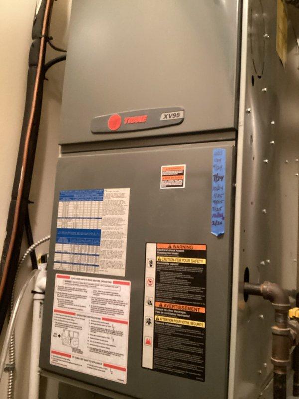 Performed scheduled BS-MVP heating maintenance on Trane XV95 furnace. Inspected and cleaned the air filter which showed normal accumulation of dust particles. System is functioning properly with all connections secure.
