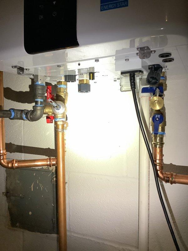 Completed tankless water heater flush service on unit with ENERGY STAR rating. Inspected all components including copper piping, pressure relief valves, and shut-off valves (red and blue handles). System was properly flushed to remove mineral buildup and restore optimal performance.