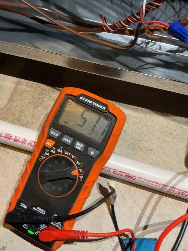 Performed maintenance verification and tune-up on heating system as scheduled. Conducted electrical testing with multimeter showing 51.7V reading on control circuit. Inspected PVC venting components and verified proper installation of copper line connections.