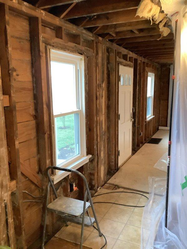 Conducted comprehensive assessment of residential rewiring requirements in 60-year-old home undergoing extensive remodel. Documented existing electrical infrastructure in areas where walls and ceilings have been opened to studs and joists. Provided customer with detailed pricing options for complete rewiring project, including fixture replacement considerations for outdated ceiling fan installation with multiple glass shades.