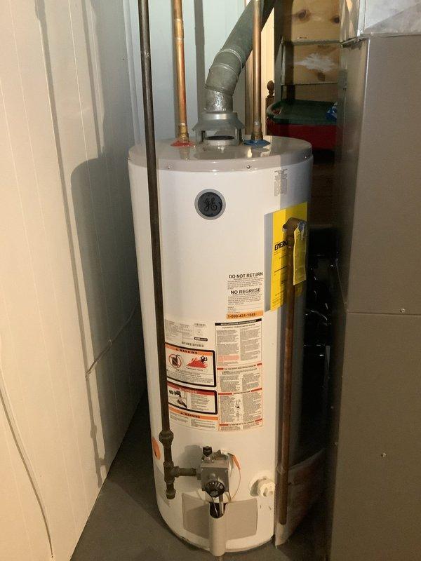 Investigated continuous water leak causing high usage. Located two sources of leakage: malfunctioning toilet and laundry sink with improperly functioning shut-off valves in basement. Inspected water heater system for potential contribution to the issue; no leaks detected there.