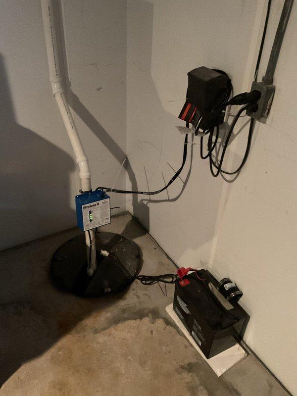Successfully replaced sump pump discharge line from the existing pump to the 4" PVC downspout. Installation included proper configuration of PVC piping with appropriate U-trap and connections through the exterior wall, ensuring effective water drainage away from the foundation.