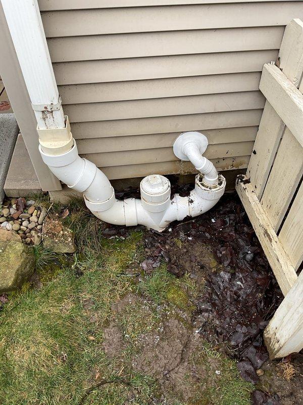 Successfully replaced sump pump discharge line from the existing pump to the 4" PVC downspout. Installation included proper configuration of PVC piping with appropriate U-trap and connections through the exterior wall, ensuring effective water drainage away from the foundation.