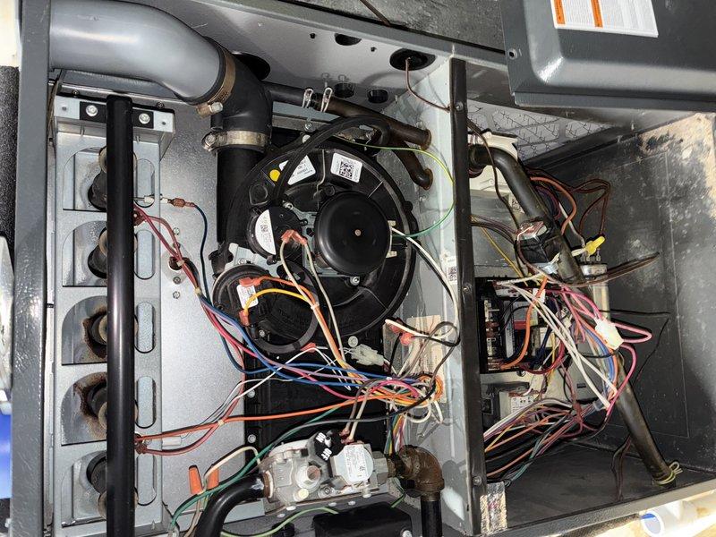 Performed scheduled HVAC heating tune-up, inspecting system components and operation. Identified significant rust development on heat exchanger housing and inspected blower assembly functionality. Documented condition of electrical connections and wiring harness for future reference.