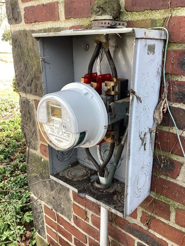 Responded to service call for intermittent power issues where customer expressed fire safety concerns. Upon inspection, found weathered electrical meter box with visible rust and dirt accumulation. Examined internal components including connection terminals and wiring, noting signs of age and debris buildup that could potentially cause intermittent electrical supply problems.