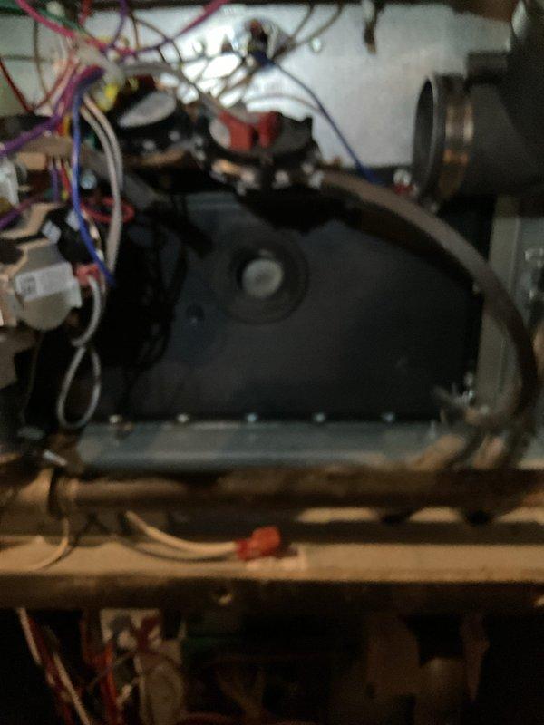Performed diagnostic inspection on 3-year-old gas furnace exhibiting no operation with blinking red light indicator. Examined interior components including inducer motor assembly, control circuitry, pressure switches, and burner elements. Scheduled follow-up appointment to replace faulty inducer motor after confirming availability of replacement parts.