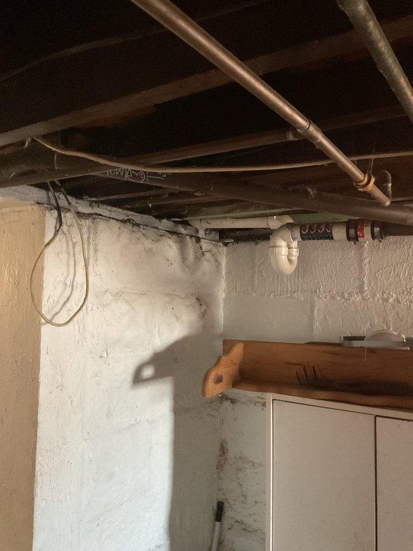 Responded to service call for clogged basement drain causing toilet backflow issues. Visual inspection of the plumbing infrastructure in unfinished basement revealed potential obstruction in the main waste line. Successfully cleared blockage using power auger/snake method between cleanout access points, restoring proper drainage function and eliminating toilet backup issues.